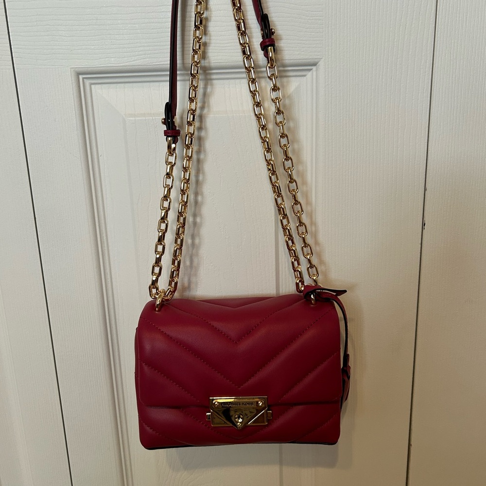 Michael Kors XS Chevron Quilted Leather Chain Crossbody. Color is Berry
